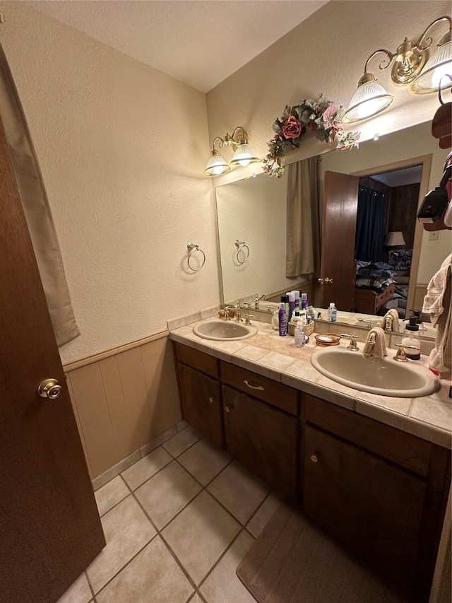 bathroom featuring tile patterned floors and vanity