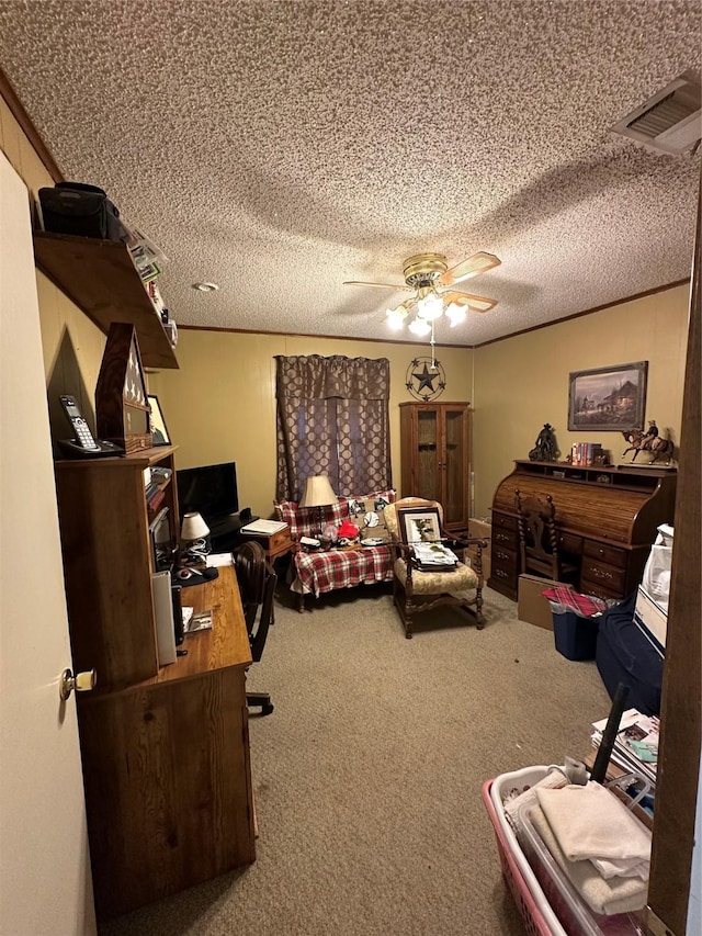 carpeted home office featuring ceiling fan and a textured ceiling