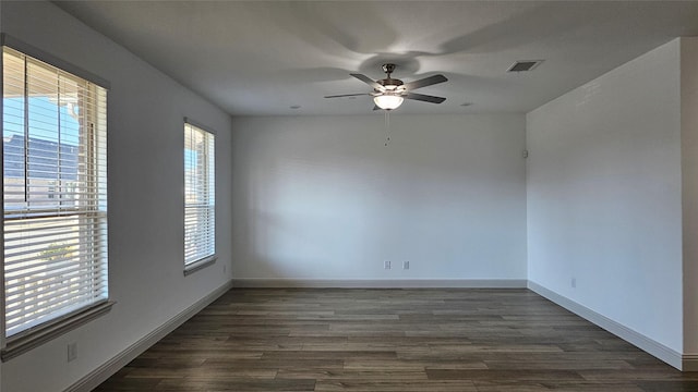 empty room featuring dark hardwood / wood-style floors and ceiling fan