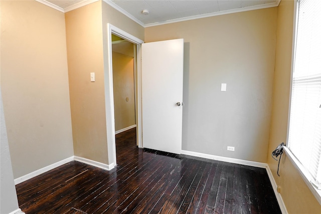 unfurnished bedroom featuring dark wood-type flooring and ornamental molding