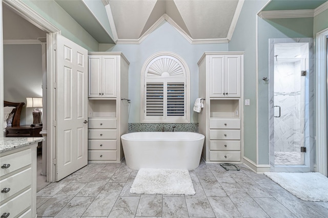 bathroom with vanity, crown molding, and plus walk in shower