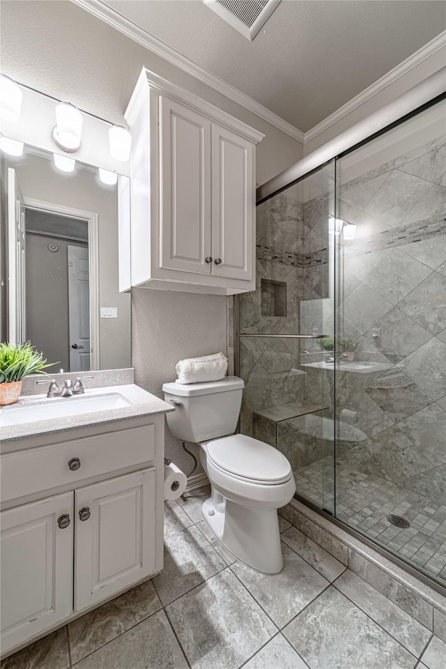 bathroom featuring vanity, ornamental molding, toilet, and walk in shower