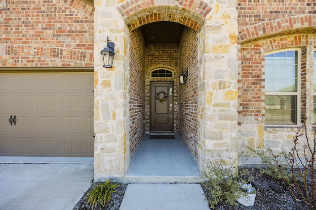 property entrance with a garage