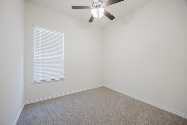 spare room featuring carpet and ceiling fan