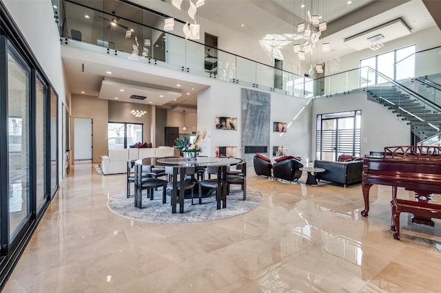 dining area with a high ceiling