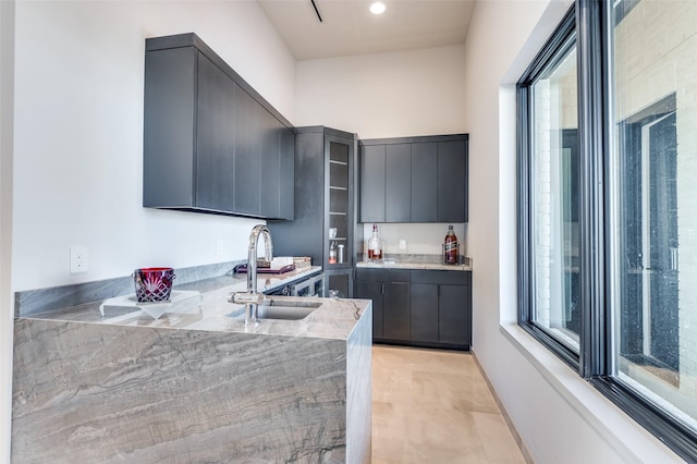 kitchen featuring sink, a wealth of natural light, and kitchen peninsula