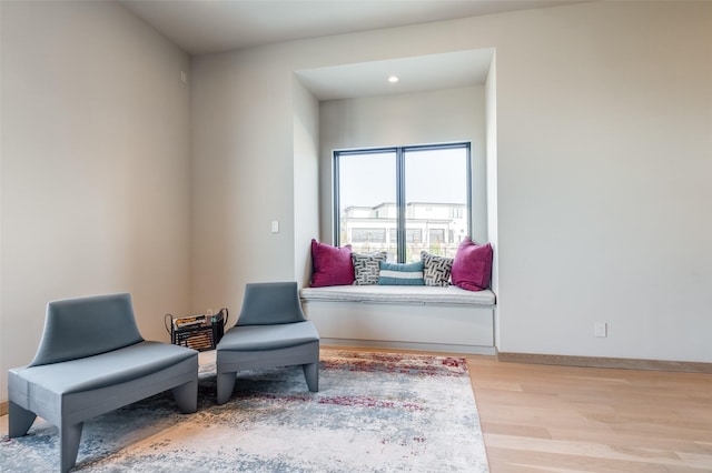 living area with light hardwood / wood-style floors