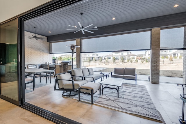 view of patio / terrace featuring an outdoor living space, area for grilling, and ceiling fan