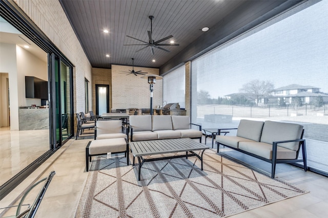 view of patio featuring an outdoor hangout area and ceiling fan