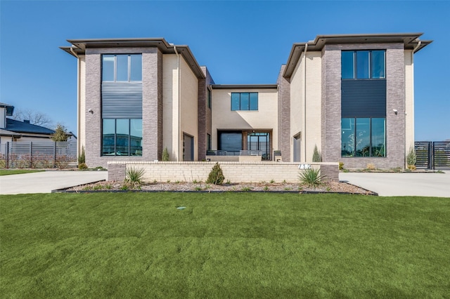 rear view of house featuring a yard