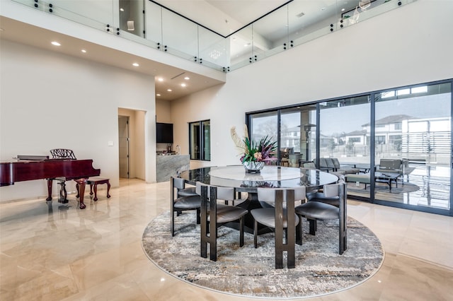 dining room with a high ceiling