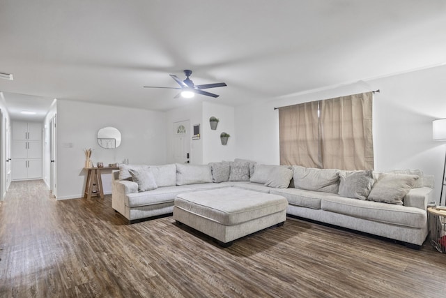 unfurnished living room with ceiling fan and dark hardwood / wood-style floors