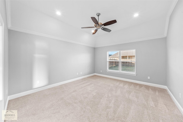 carpeted empty room featuring crown molding and ceiling fan