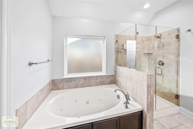 bathroom featuring tile patterned floors, lofted ceiling, and separate shower and tub