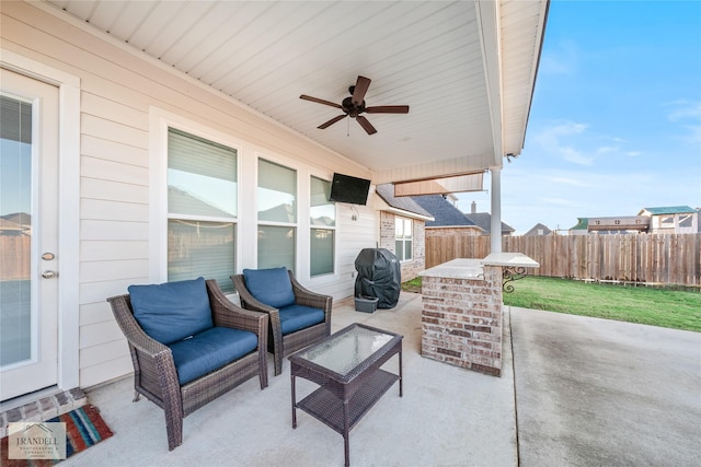 view of patio / terrace featuring a grill and ceiling fan