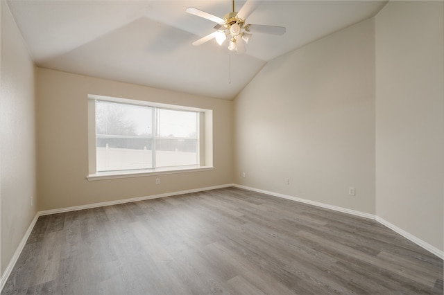 spare room with vaulted ceiling, ceiling fan, and hardwood / wood-style floors