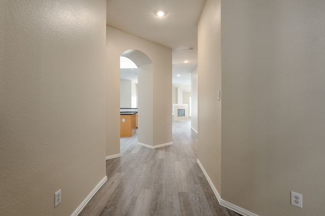 corridor featuring hardwood / wood-style floors