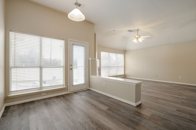 unfurnished room featuring ceiling fan and dark hardwood / wood-style flooring