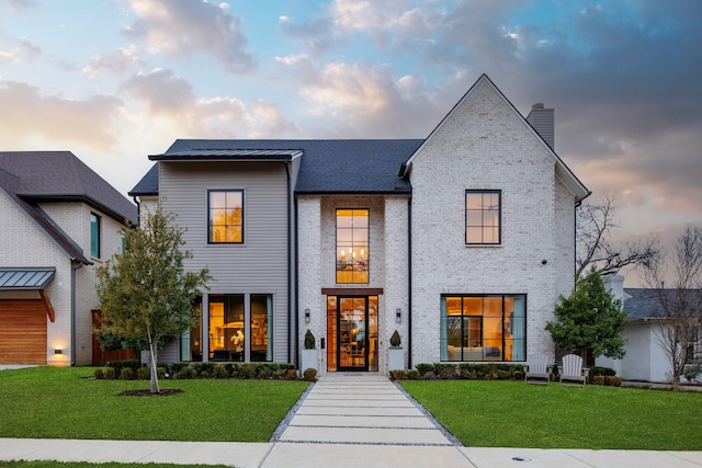 view of front facade with a lawn