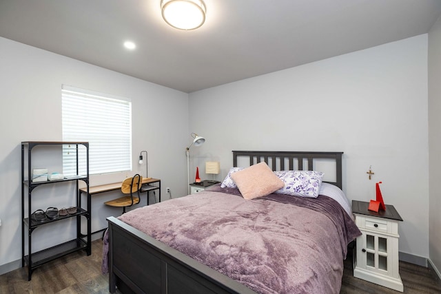 bedroom featuring dark hardwood / wood-style flooring