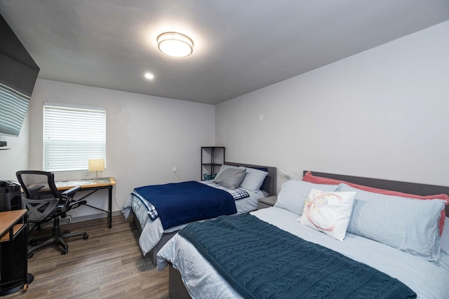 bedroom with hardwood / wood-style floors