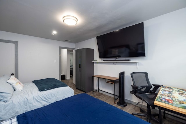 bedroom featuring wood-type flooring