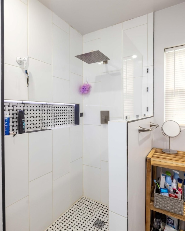 bathroom with a tile shower