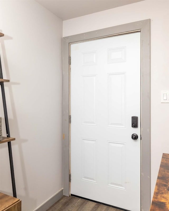 entryway with dark wood-type flooring