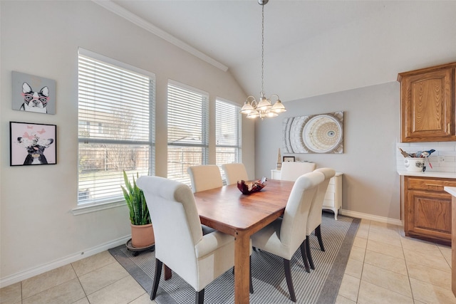 dining room with light tile patterned floors, baseboards, vaulted ceiling, and an inviting chandelier