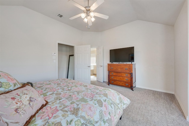 carpeted bedroom featuring lofted ceiling, baseboards, visible vents, and a ceiling fan