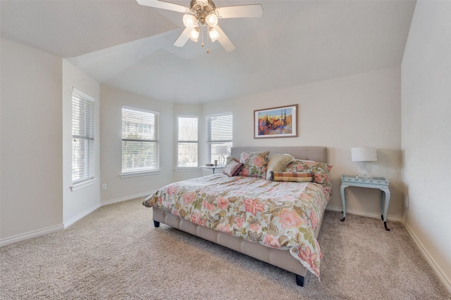 carpeted bedroom featuring ceiling fan and baseboards