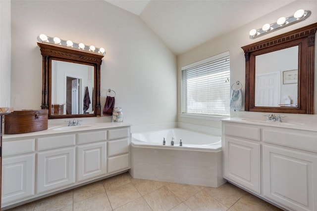 bathroom with lofted ceiling, tile patterned flooring, two vanities, and a sink