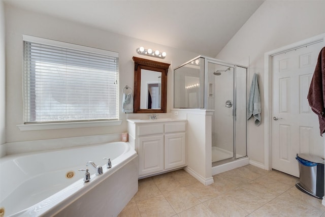 bathroom with a stall shower, vaulted ceiling, vanity, and a bath