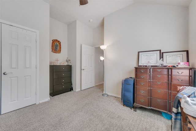 bedroom with carpet floors, ceiling fan, baseboards, and vaulted ceiling