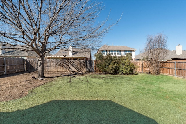 view of yard featuring a fenced backyard