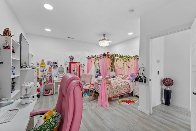 bedroom with light hardwood / wood-style flooring