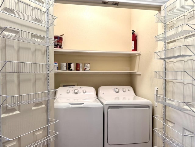 laundry area with separate washer and dryer