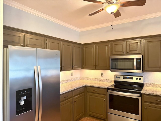 kitchen featuring ornamental molding, appliances with stainless steel finishes, ceiling fan, and light stone counters