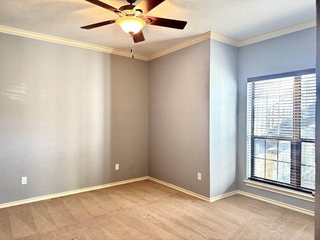 unfurnished room featuring crown molding, light carpet, a textured ceiling, and ceiling fan