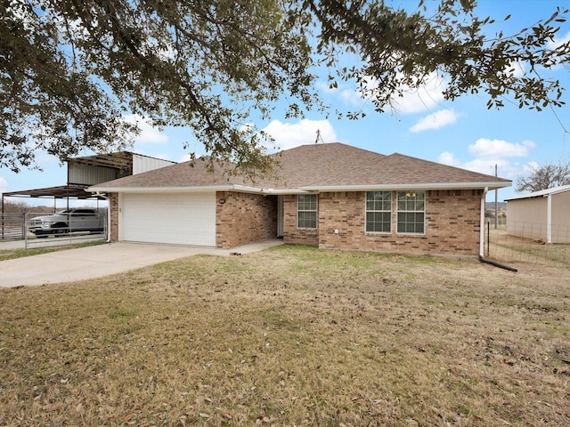 ranch-style house featuring a carport, a garage, and a front lawn