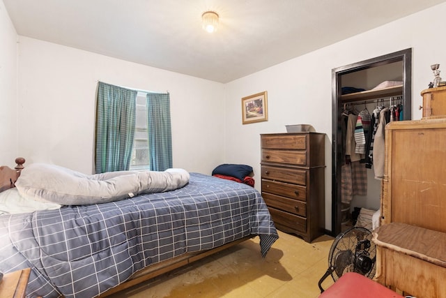 bedroom featuring a spacious closet and a closet