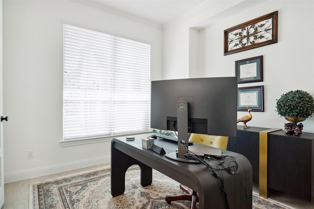 office area featuring hardwood / wood-style flooring and ornamental molding