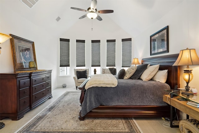 bedroom featuring vaulted ceiling, ceiling fan, and light hardwood / wood-style flooring