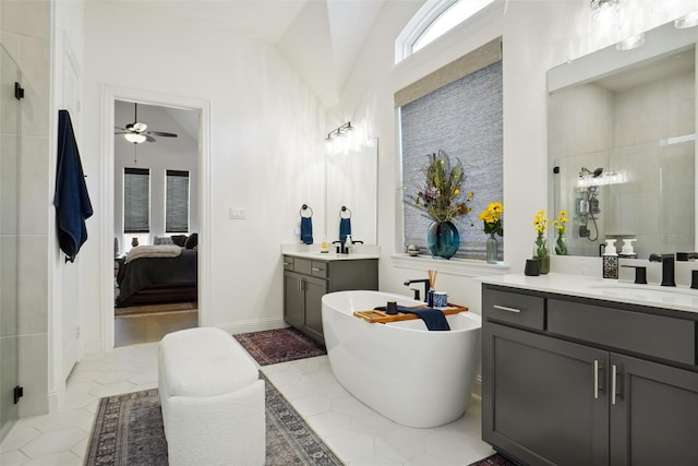 bathroom with tile patterned flooring, vanity, and separate shower and tub