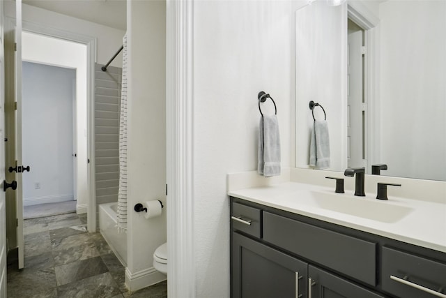 full bathroom featuring vanity, toilet, and  shower combination