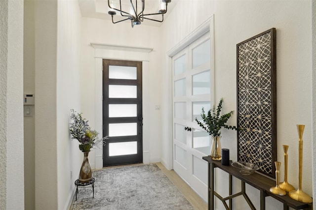 entrance foyer featuring an inviting chandelier