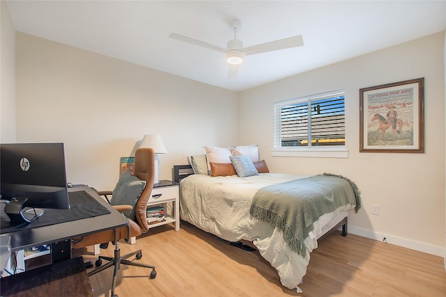 bedroom with ceiling fan and light hardwood / wood-style flooring