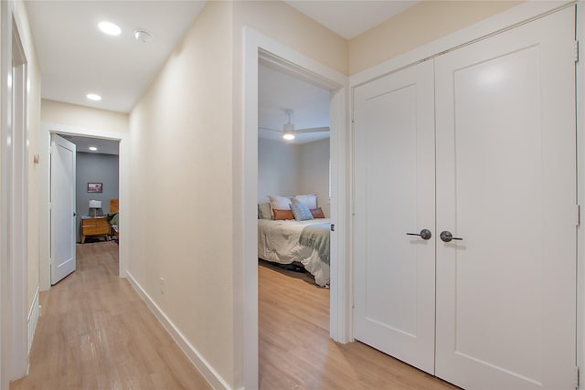 corridor featuring light hardwood / wood-style flooring