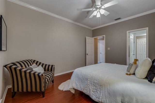 bedroom with ceiling fan, ornamental molding, and dark hardwood / wood-style flooring