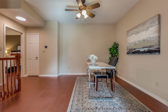 dining area with hardwood / wood-style flooring and ceiling fan